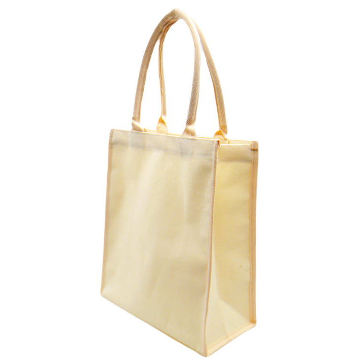 A side view of an eco-friendly canvas tote bag in beige