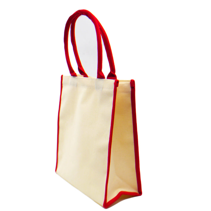 A side view of an eco-friendly canvas tote bag in red trimmings
